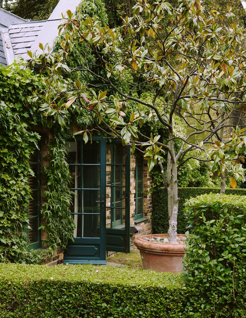Image may contain Garden Arbour Outdoors Plant Porch and Patio