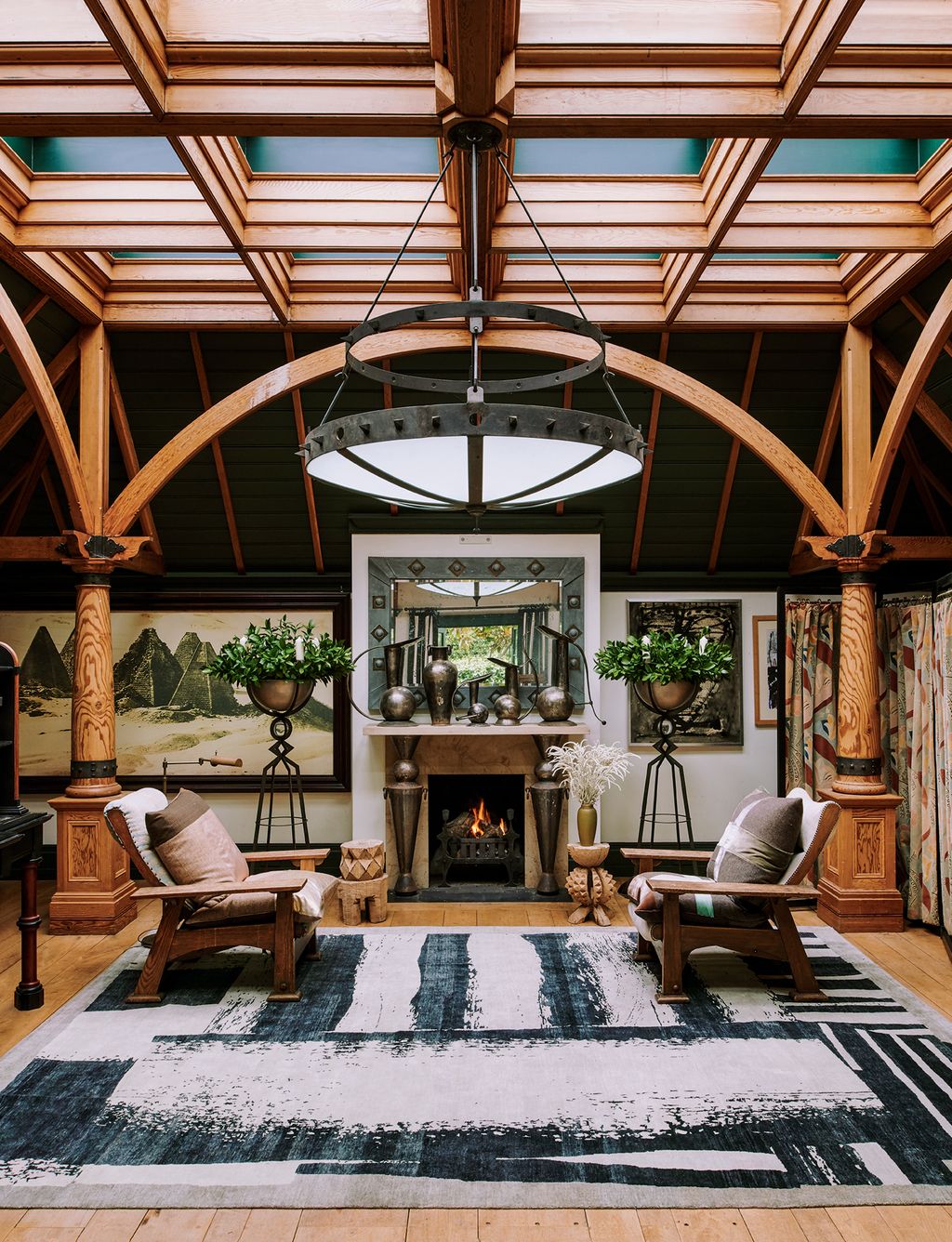 Image may contain Living Room Room Indoors Interior Design Furniture Lobby Rug Fireplace and Couch