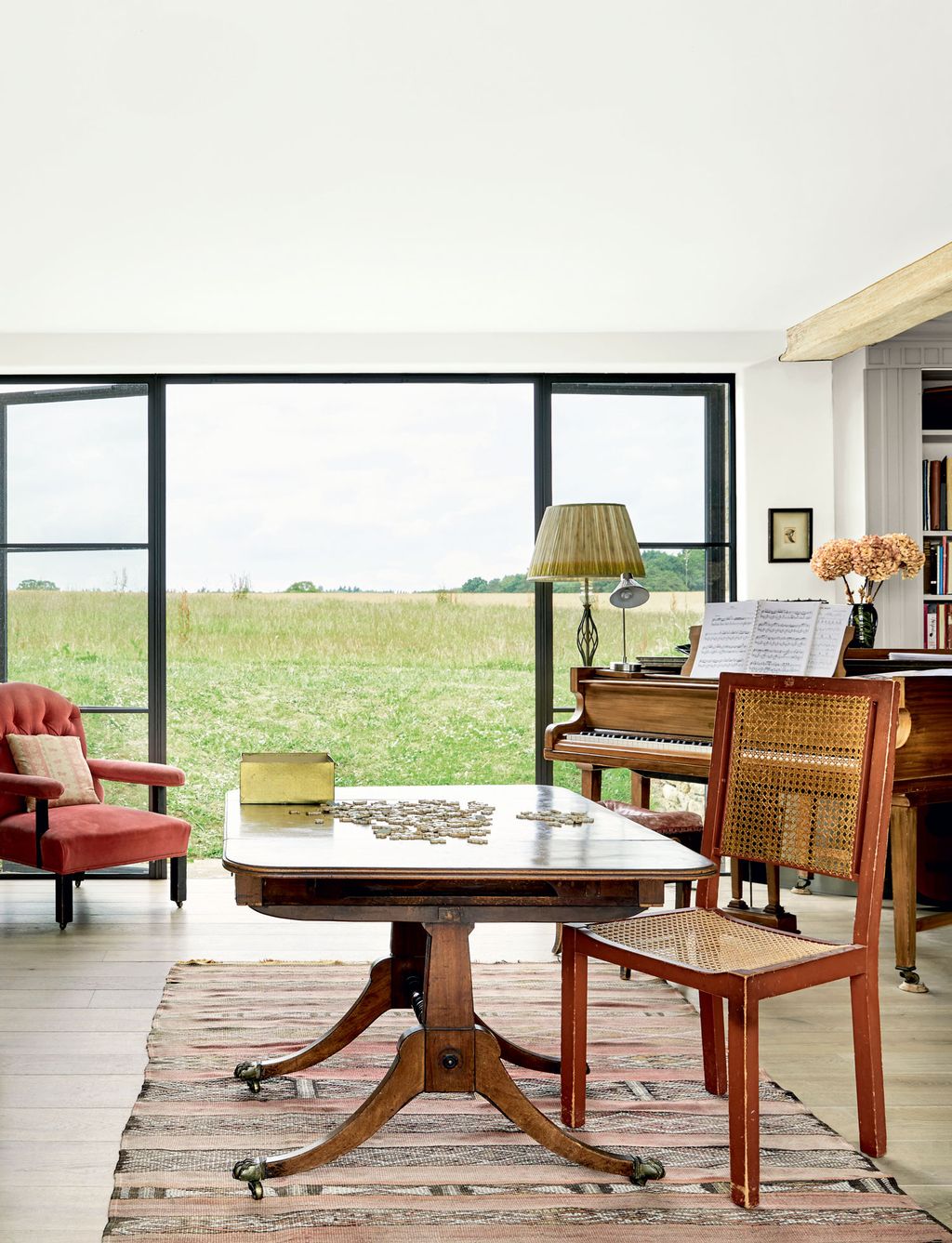 On a Moroccan rug beside the grand piano in the central area a Georgian table always has a jigsaw in progress.