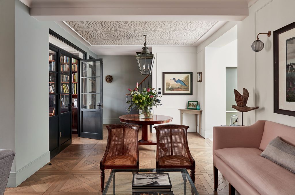 Image may contain Flooring Indoors Interior Design Furniture Floor Wood Living Room Room Hardwood Chair and Plant