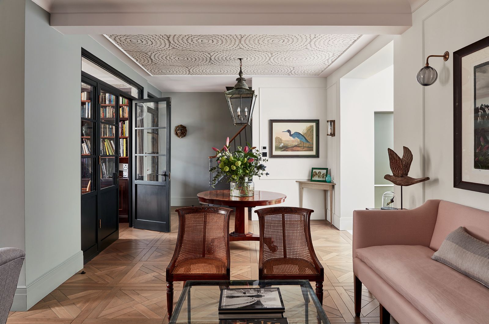 Image may contain Flooring Indoors Interior Design Furniture Floor Wood Living Room Room Hardwood Chair and Plant