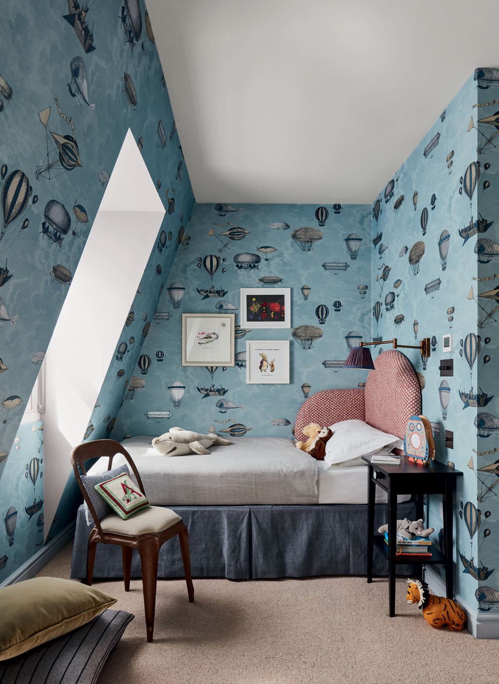 Image may contain Room Bedroom Indoors Dorm Room Furniture Chair Housing Building Cushion and Pillow