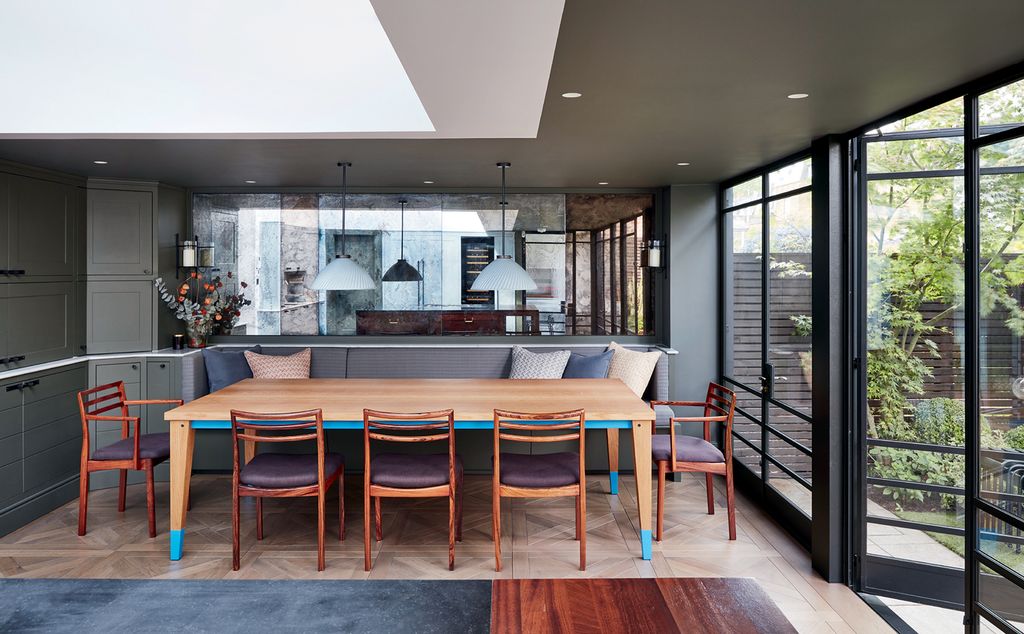 The vintage rosewood chairs came from Danish Homestore and the oak ‘Arx Table is by Bullenberg. A continuous marble sill...