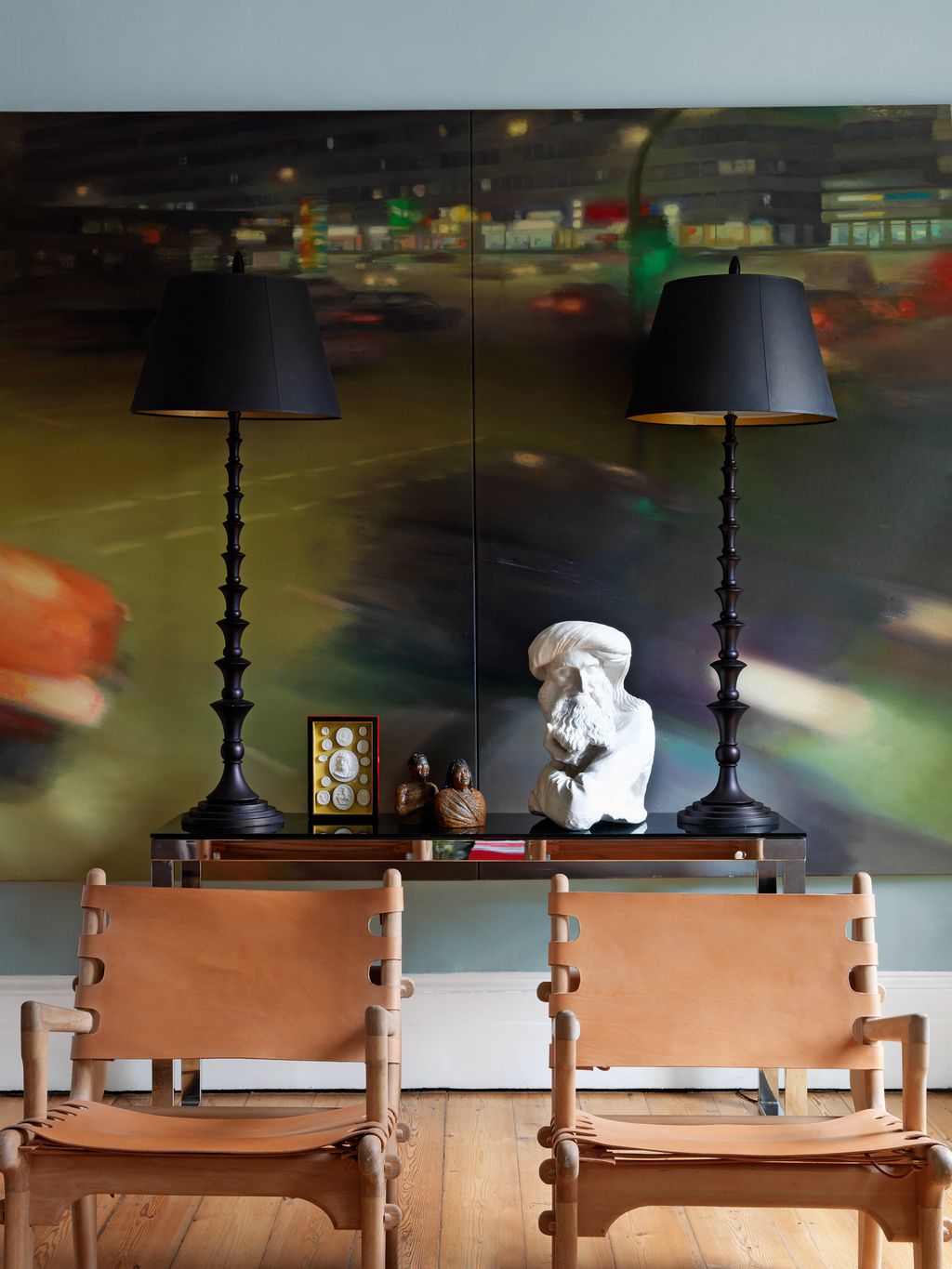 The sitting room houses many of Bridie's own designs including the cowhide and beech 'Trav' chairs.