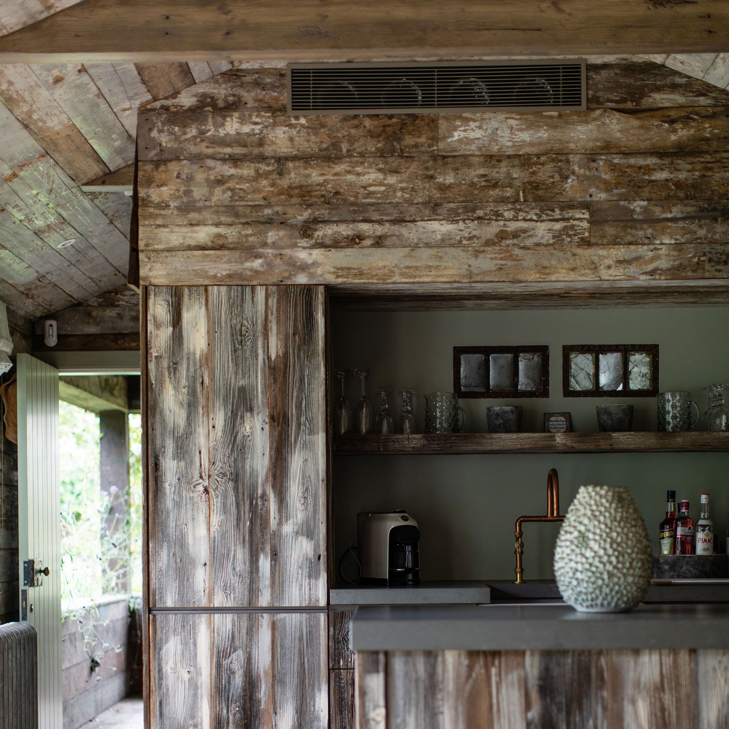 A charming wooden summer house in a verdant London garden