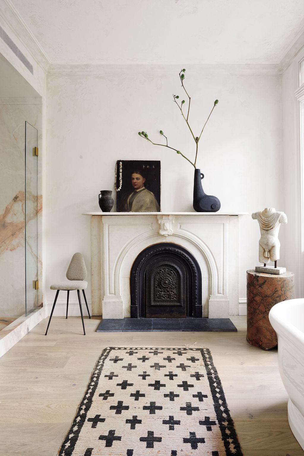 Image may contain Indoors Rug Interior Design Human Person Fireplace Hearth Room Home Decor and Flooring