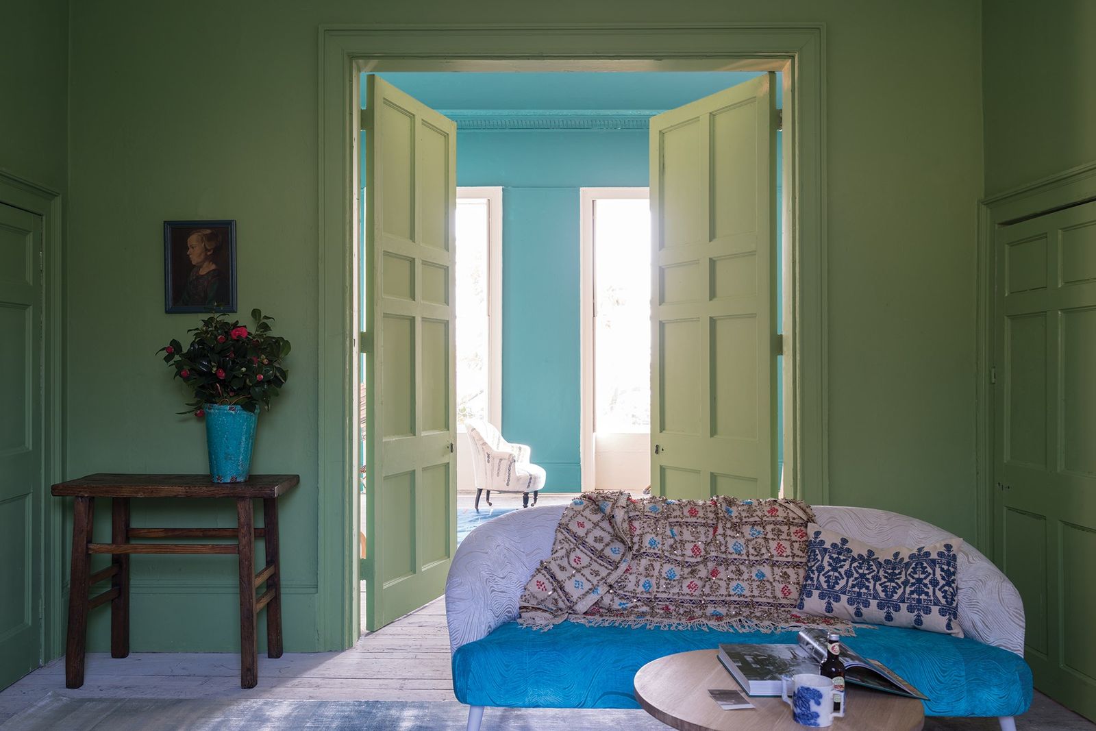 Image may contain Furniture Couch Living Room Room Indoors Flooring Interior Design and Bedroom