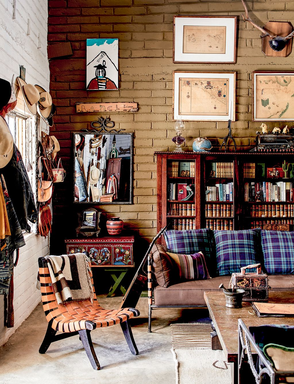 Image may contain Furniture Chair Living Room Indoors Room Couch Interior Design Table and Shelf