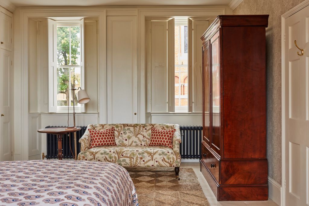 Image may contain Furniture Room Indoors Living Room Wood and Rug