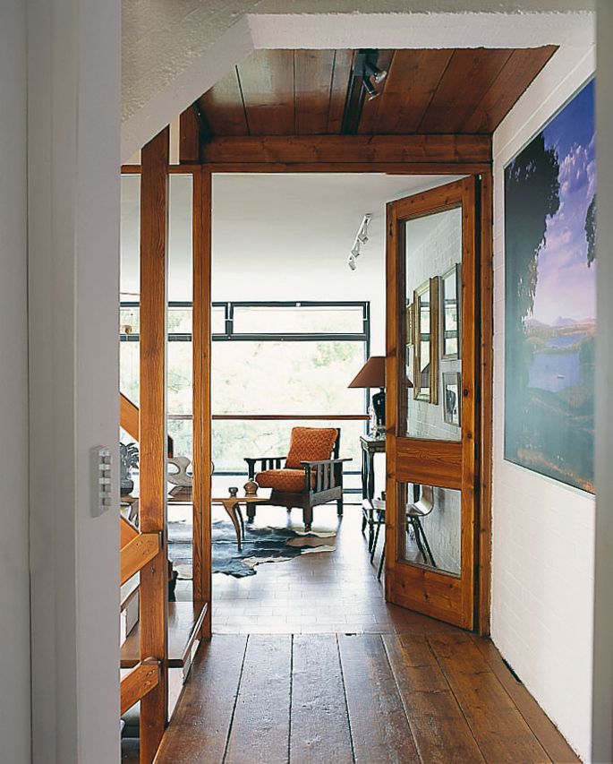 Image may contain Furniture Chair Wood Flooring Floor Hardwood Door Interior Design and Indoors