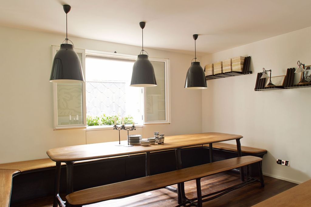 Image may contain Indoors Room Furniture Lighting Wood Table Interior Design and Flooring