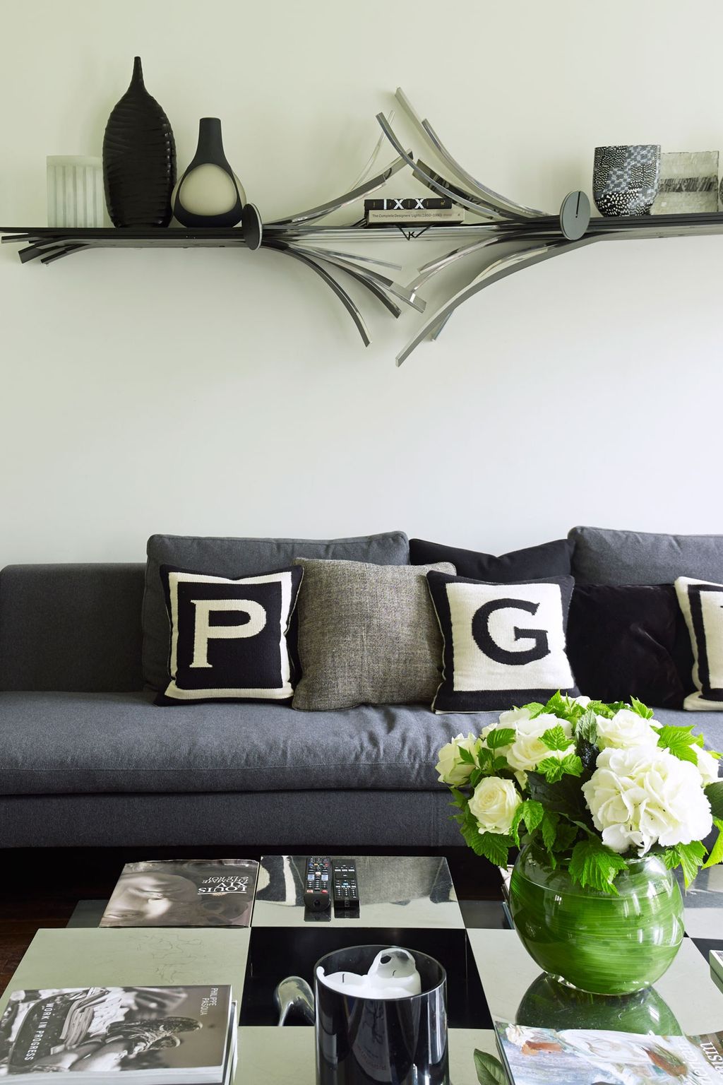 Image may contain Couch Furniture Living Room Indoors Room Table Coffee Table and Cushion