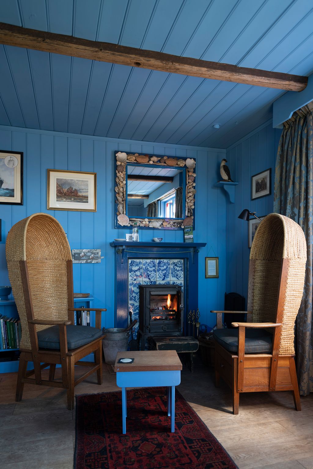 Image may contain Furniture Chair Living Room Indoors Room Home Decor Hearth Fireplace and Interior Design