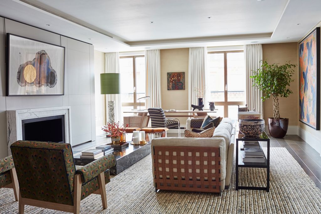 Image may contain Living Room Room Indoors Furniture Chair Lobby Interior Design Couch and Rug