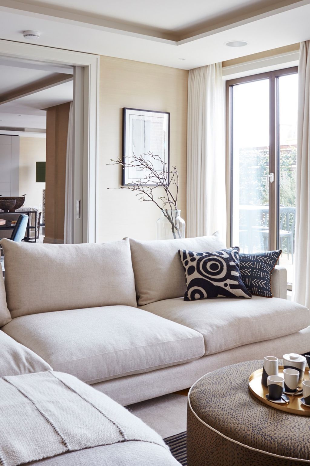 Image may contain Furniture Couch Cushion Table Home Decor Living Room Indoors Room Coffee Table and Pillow