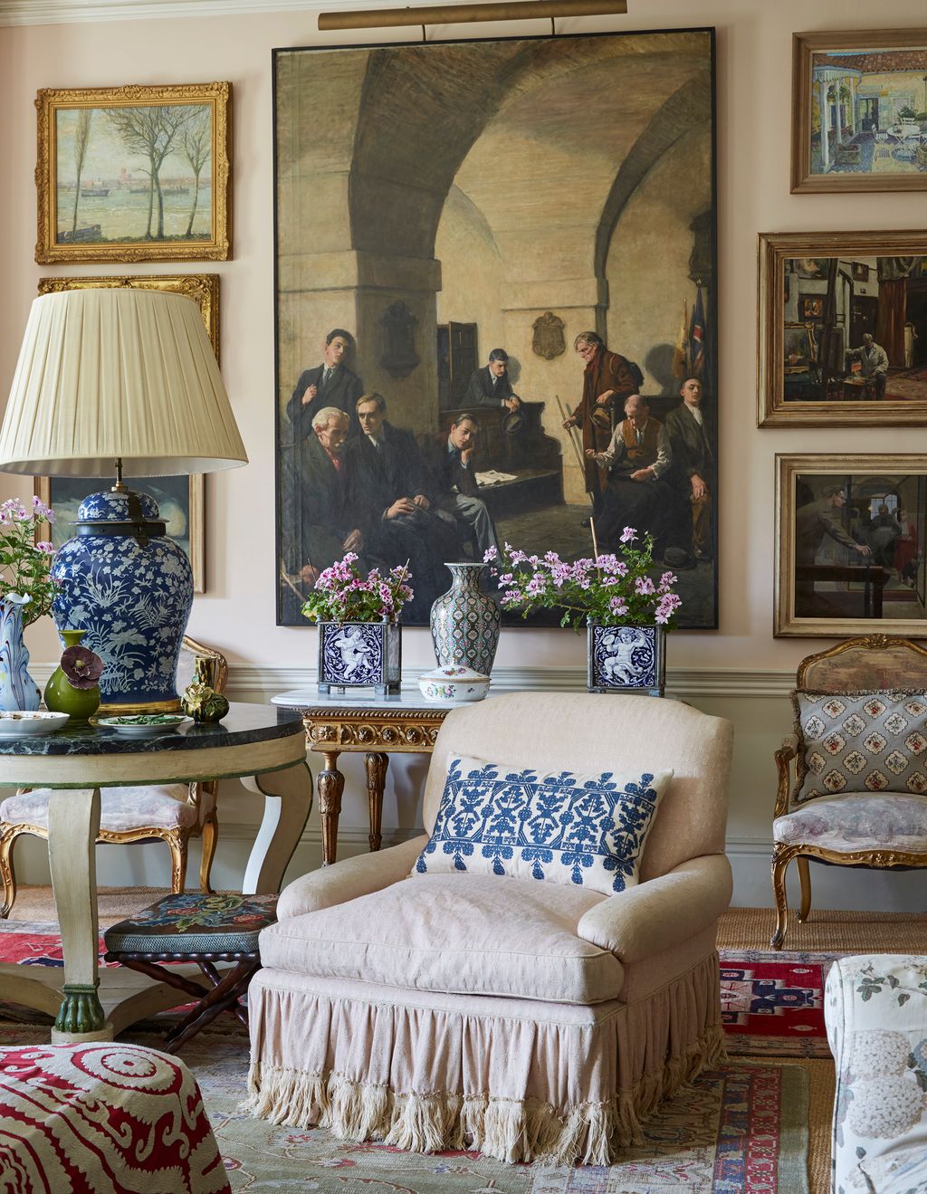 Image may contain Furniture Living Room Room Indoors Human Person Lamp Table Lamp and Couch