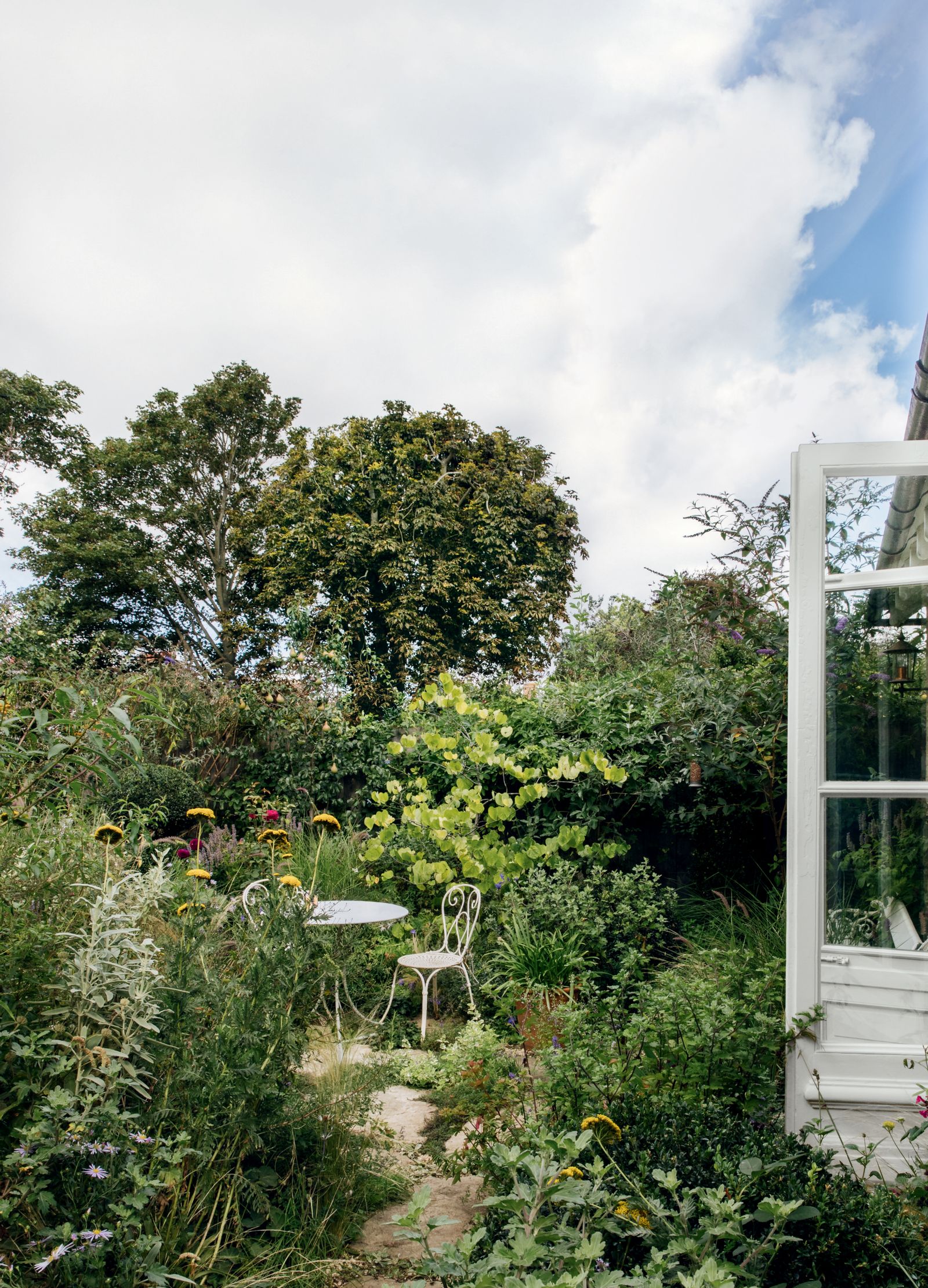 Image may contain Outdoors Garden Arbour and Patio