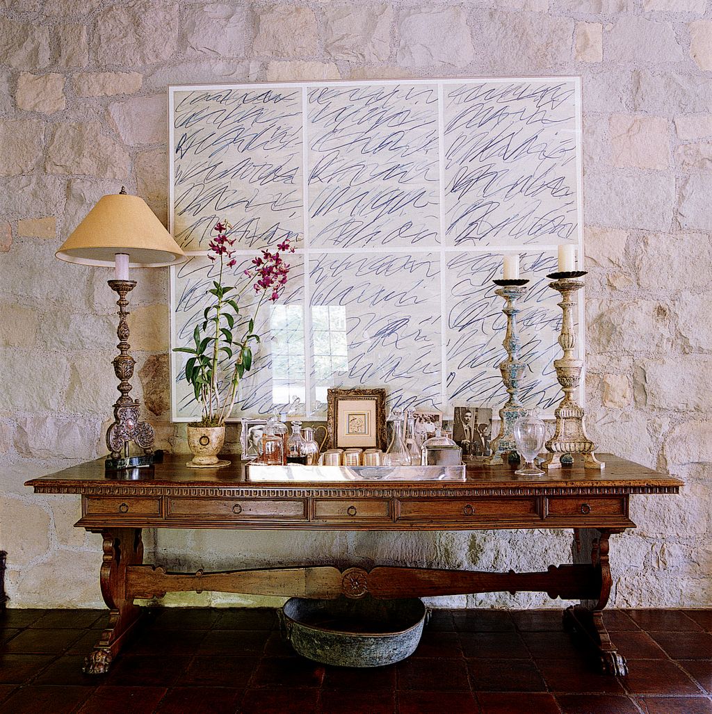 The juxtaposition of different architectural scales is one of John's trademark techniques here on a table in the drawing...