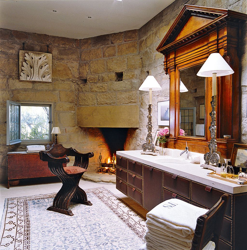 Image may contain Indoors Room Living Room Flooring Wood Interior Design Hardwood Fireplace and Hearth