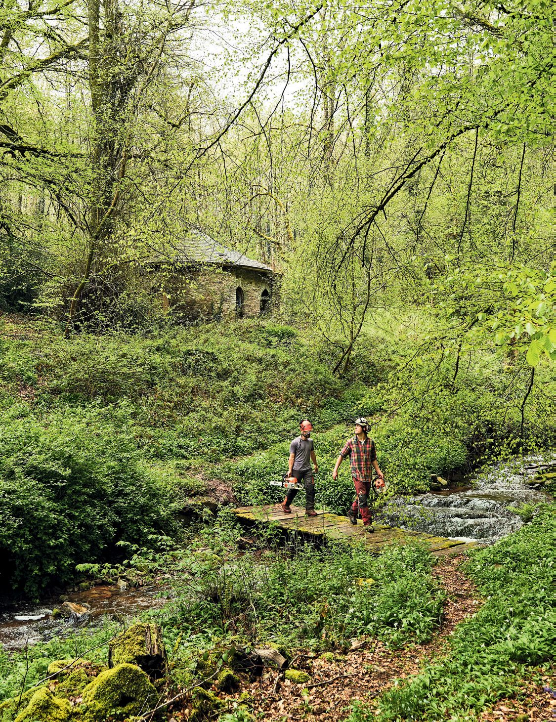Image may contain Nature Outdoors Human Person Building Countryside Rural Hut Housing Water and Shack