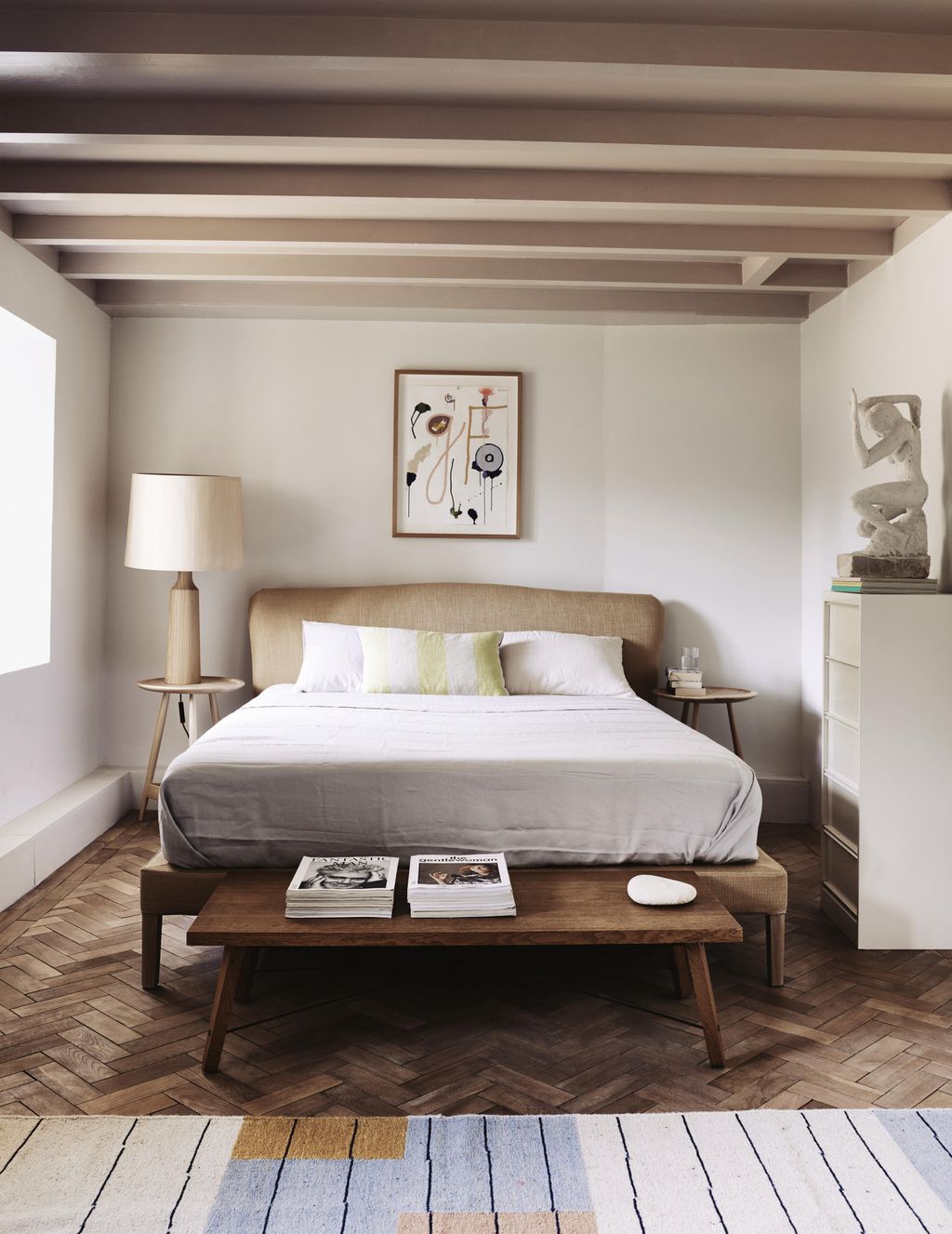 A sculpture by Russells father John looks over a Pinch ‘Moreau bed. On the ceiling Farrow Balls ‘Peignoir paint in...