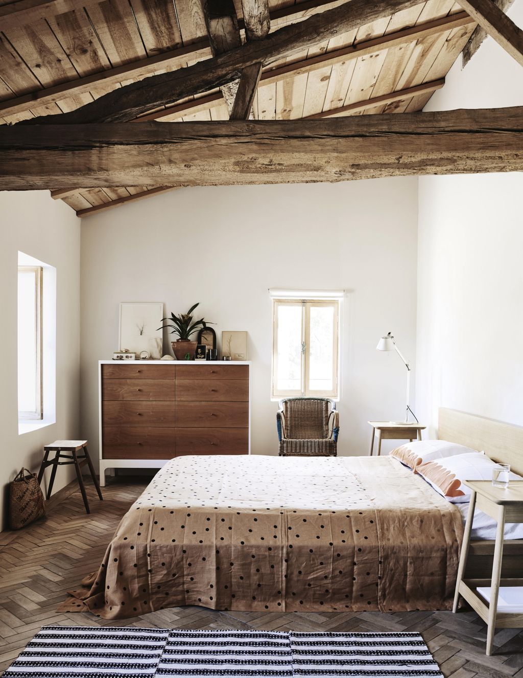 Bed linen by Castle and a striped kilim from Morocco complement Pinchs ‘Joyce chest of drawers and oak ‘Harlosh bedside...