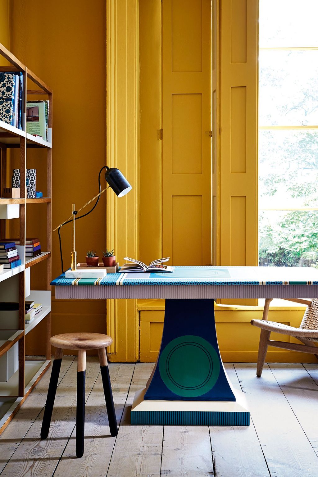 This vibrant office has been painted in a sunny yellow 'O8D02' from Little Greene. Cressida Bell has adorned a...