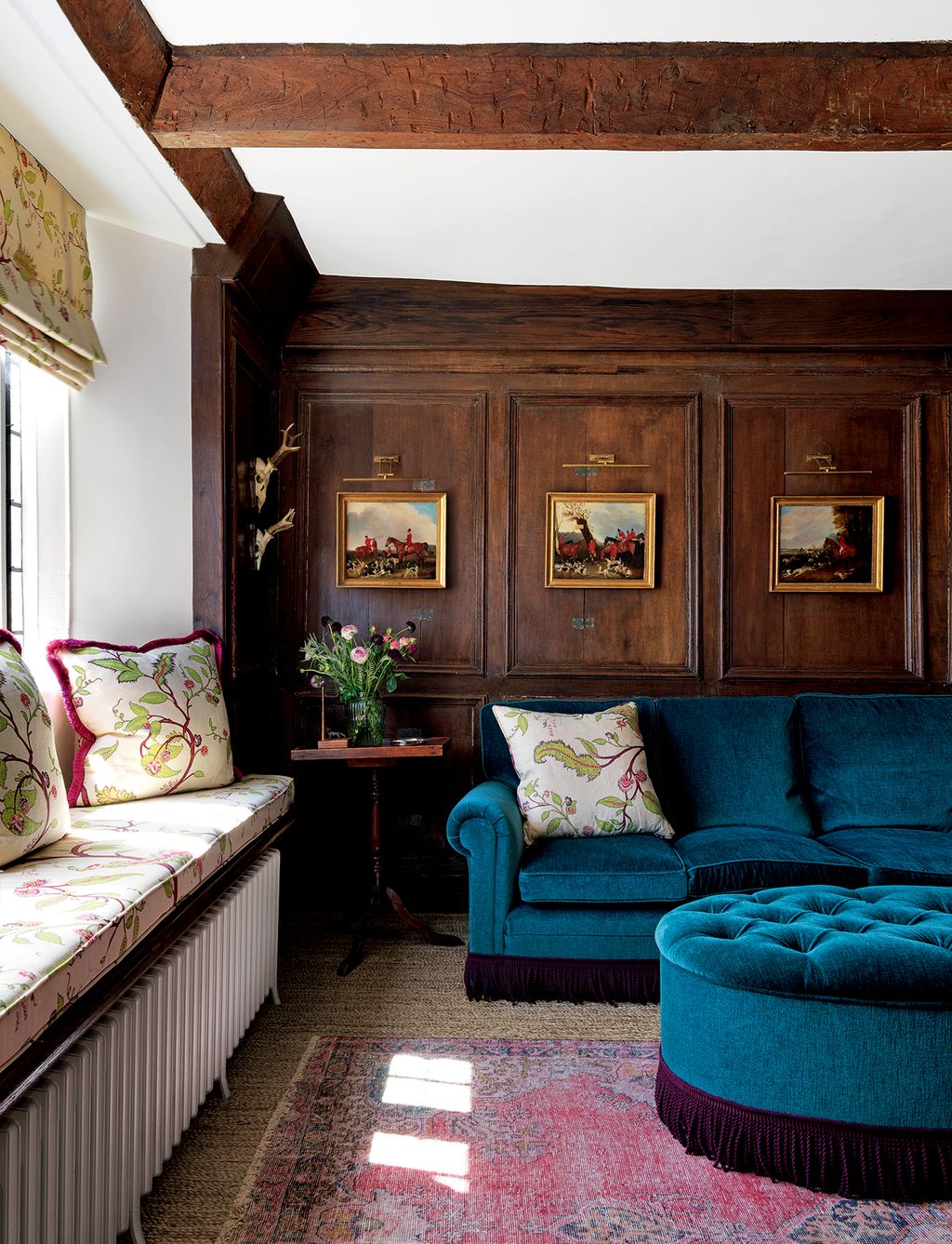 Image may contain Furniture Couch Living Room Indoors Room Rug and Ottoman