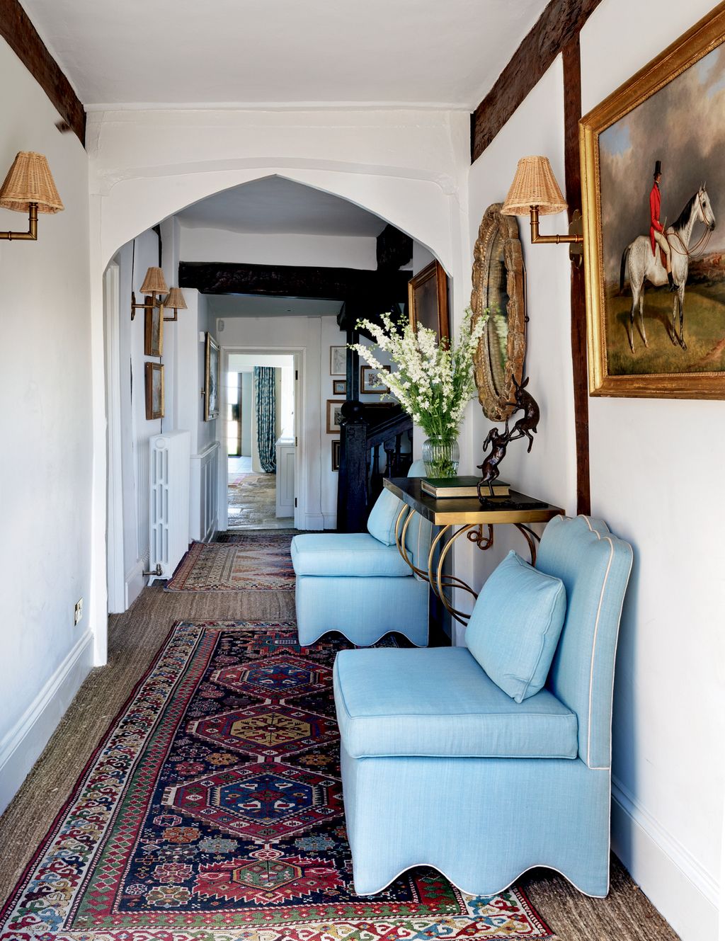 In the hall chairs from Paolo Moschino for Nicholas Haslam are paired with a ‘Scroll Bracket Console table and wall...