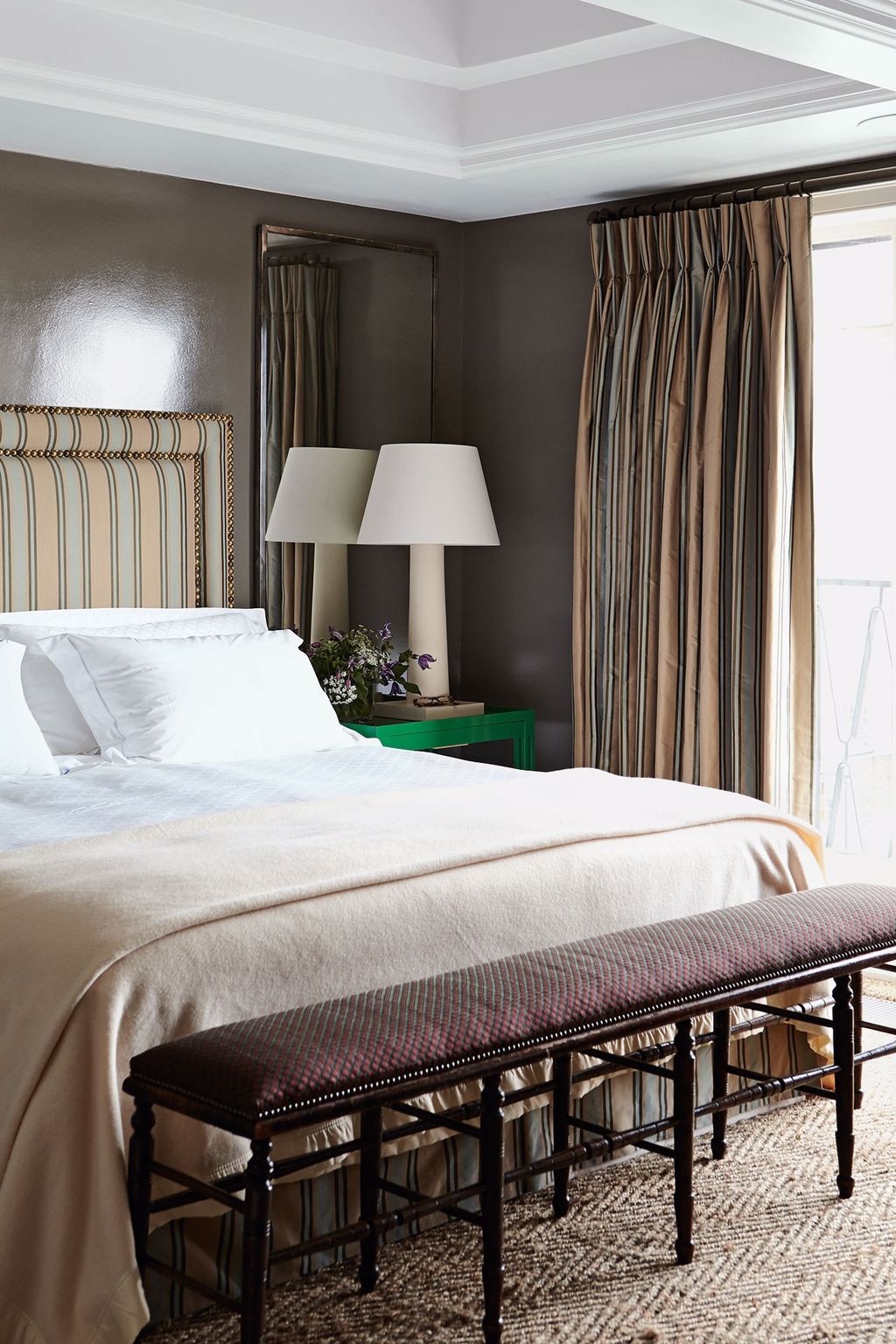 Bluegreen gloss reappears in the main bedroom though this time in a muddier version. Here the striped silk curtains and...