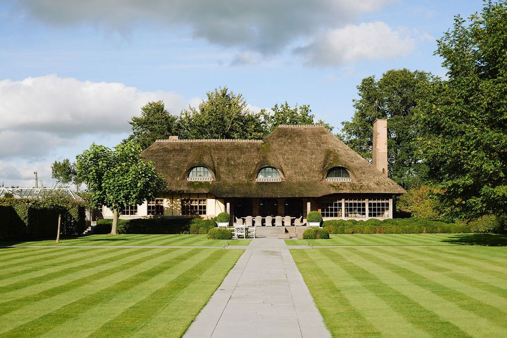 Image may contain Plant Grass Lawn Building and Housing