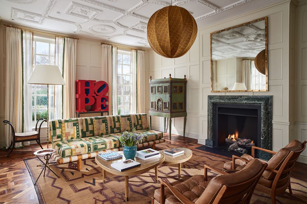 Image may contain Furniture Indoors Table Living Room Room Fireplace Chair Hearth Coffee Table and Interior Design