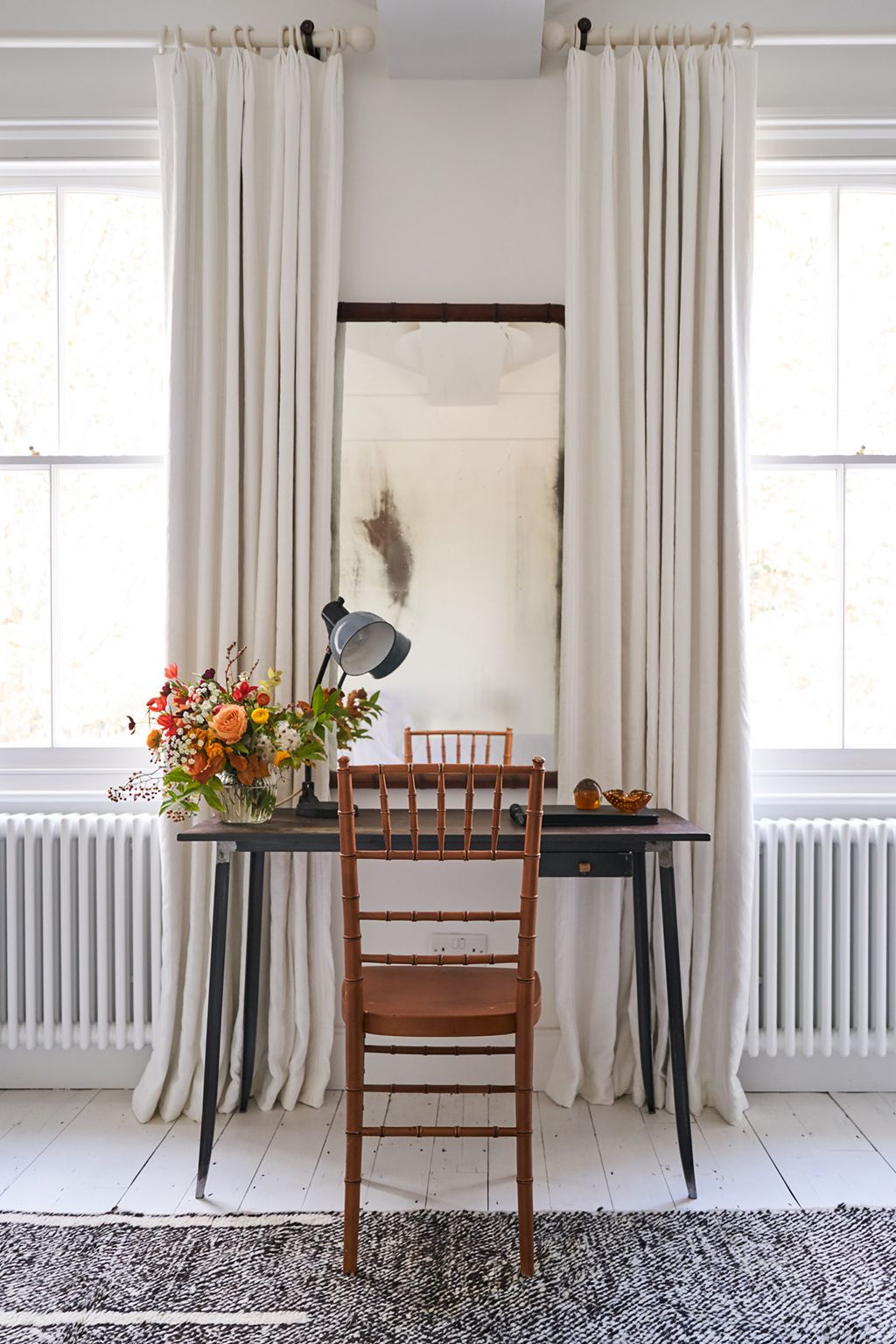 Image may contain Interior Design Indoors Furniture Chair Home Decor Plant Room Flower and Blossom