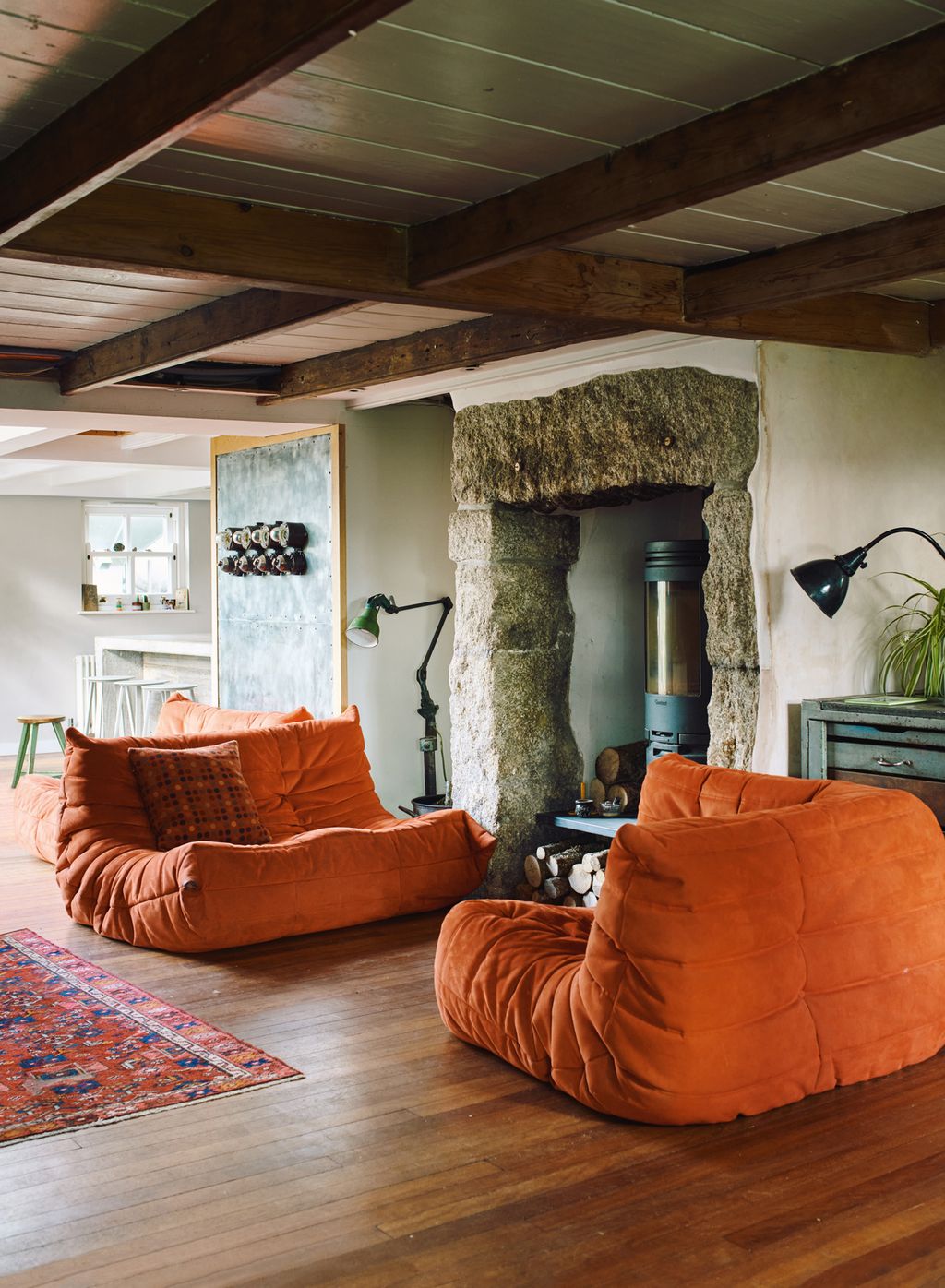 Image may contain Furniture Couch Living Room Room Indoors Wood Flooring Hardwood Interior Design and Home Decor