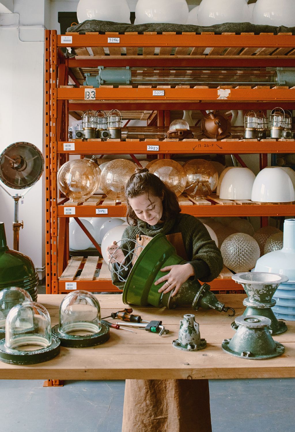 Image may contain Shelf Human Person Furniture Cabinet China Cabinet Pottery Interior Design Indoors and Bowl