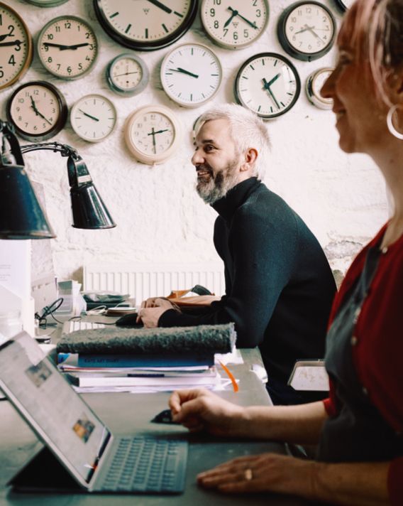 Image may contain Human Person Clock Tower Architecture Tower Building Furniture Clock and Analog Clock