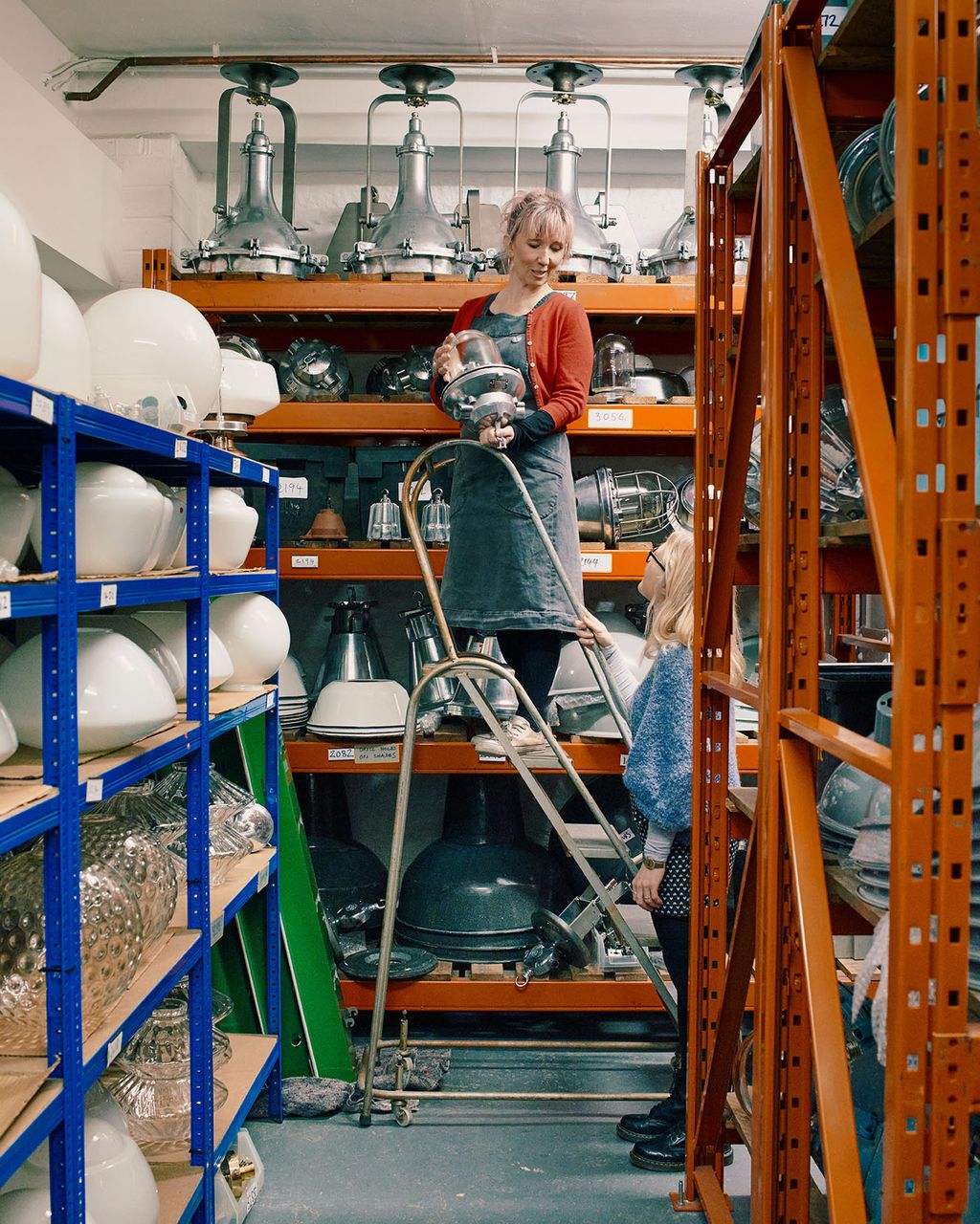 Image may contain Shelf Clothing Apparel Human Person Wood Plywood Helmet and Pants