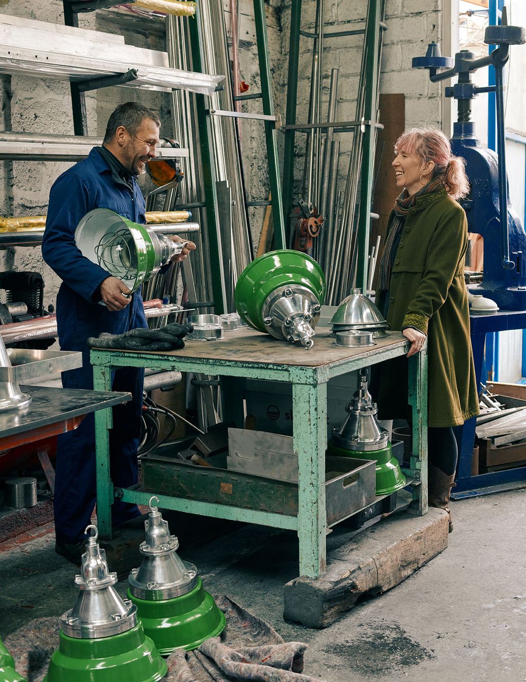 Image may contain Factory Building Human Person Manufacturing Machine Clothing and Apparel