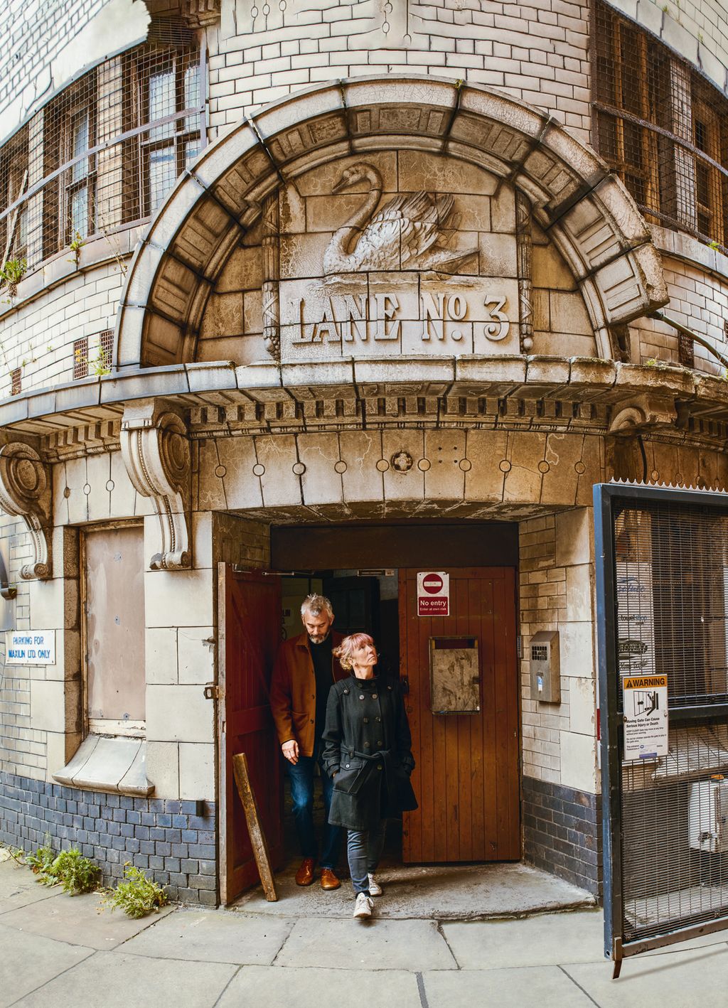 Image may contain Human Person Clothing Apparel Coat Overcoat Footwear and Shoe