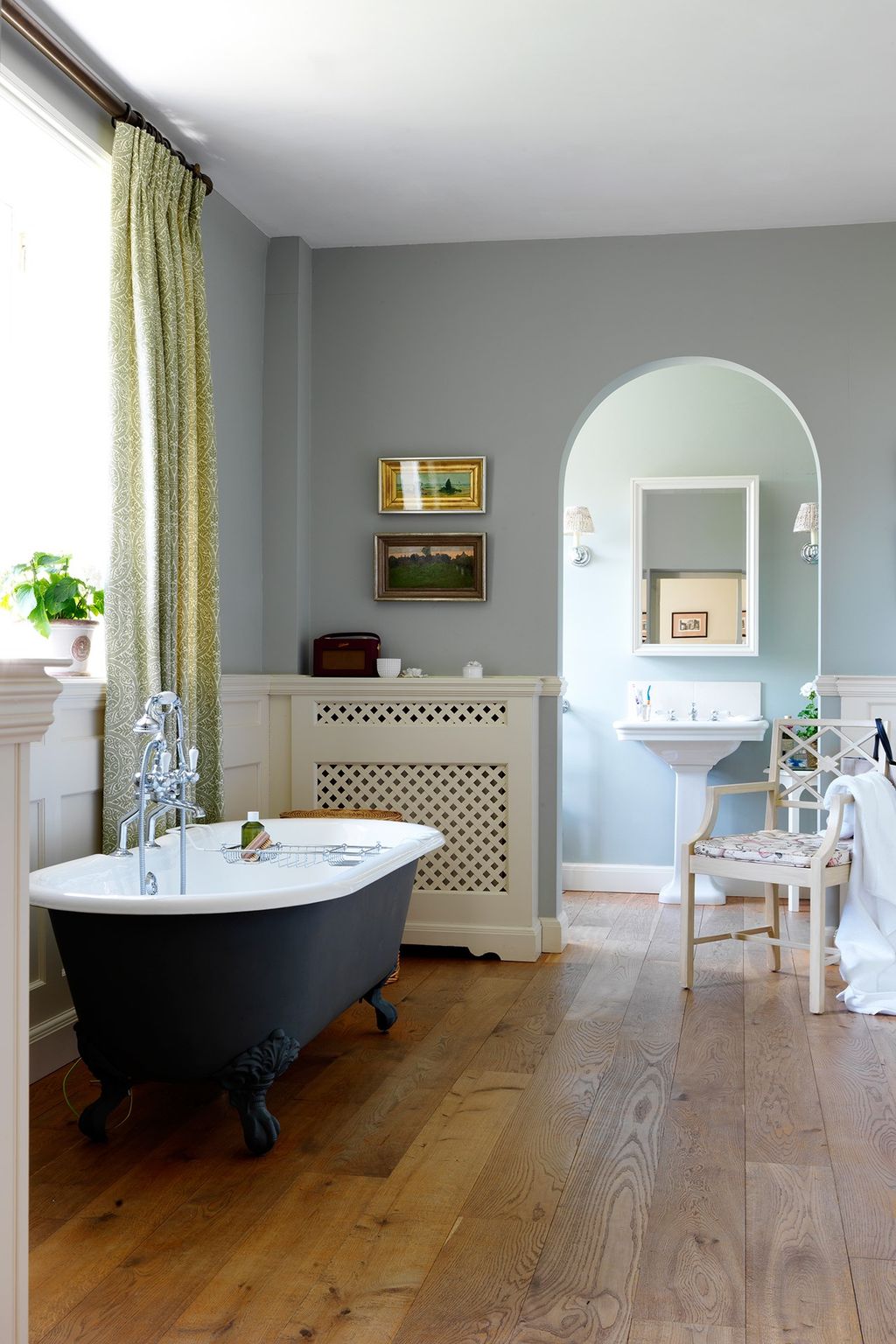 Image may contain Flooring Interior Design Indoors Tub Bathtub Room Wood Floor and Bathroom