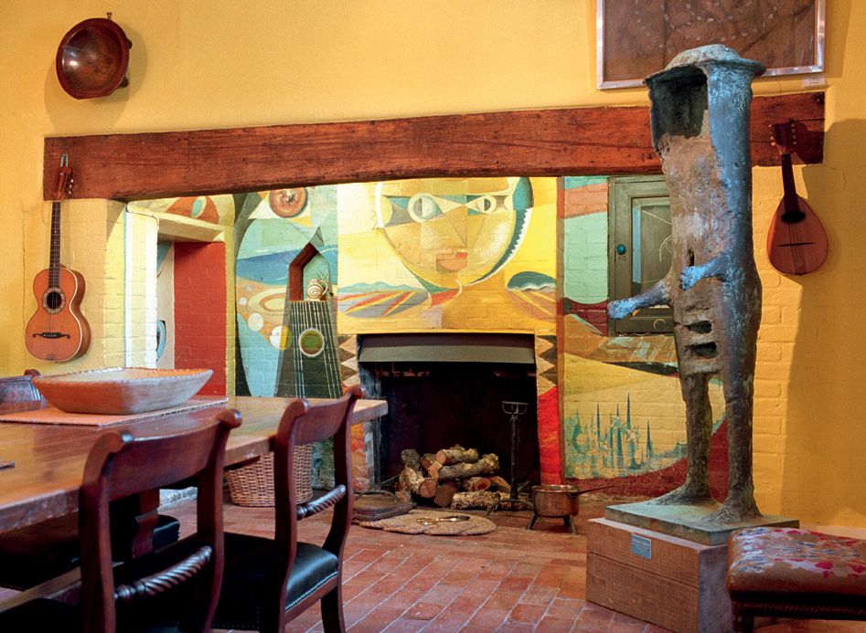 Image may contain Furniture Chair Interior Design Indoors Home Decor Fireplace Hearth Living Room Room and Flooring