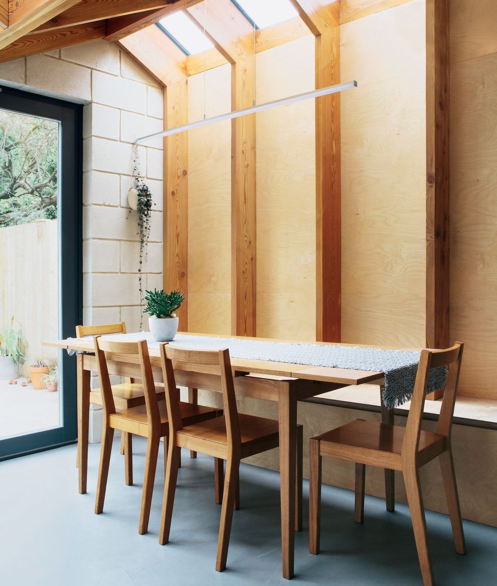 Image may contain Furniture Chair Table Dining Table Wood Tabletop Indoors Room Plywood and Door