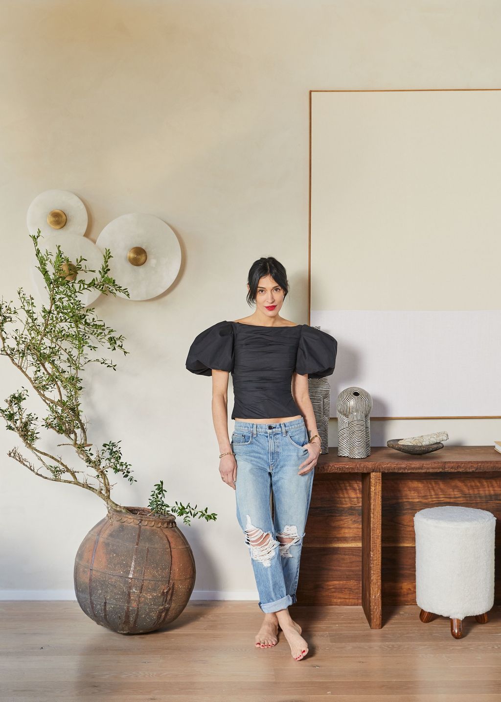 Image may contain Pants Clothing Apparel Human Person Jeans Denim Indoors Interior Design Pottery and Shelf