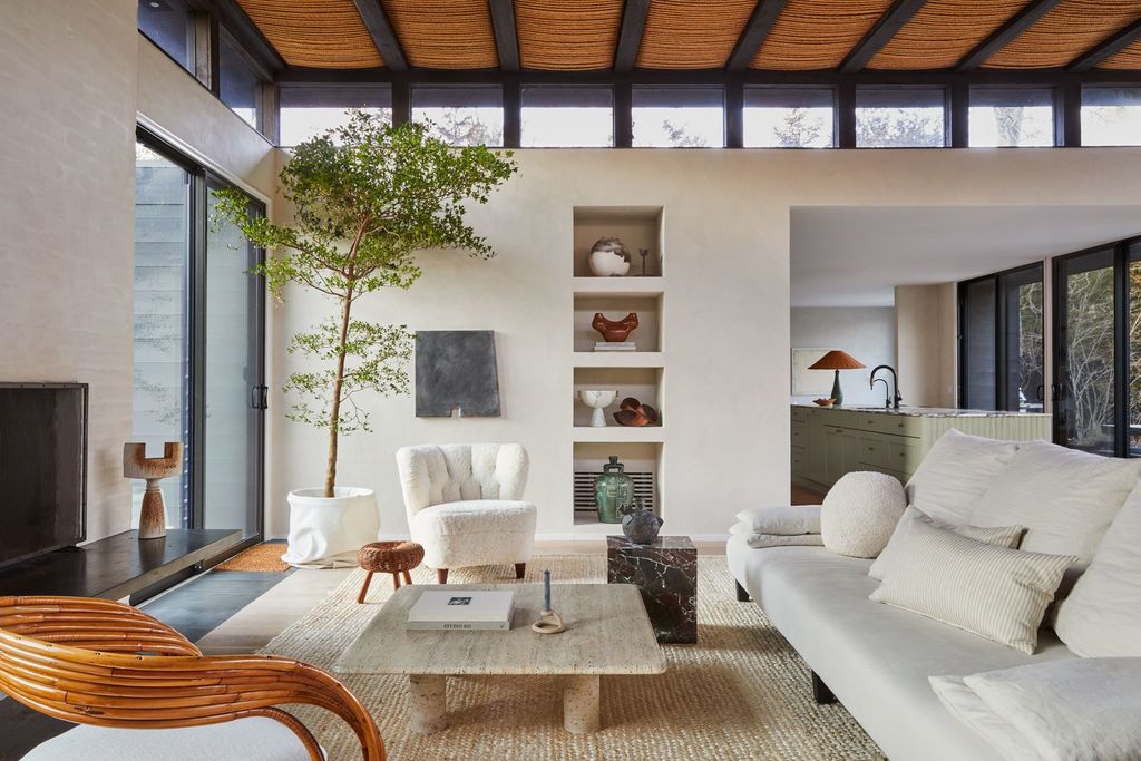 Image may contain Furniture Living Room Room Indoors Interior Design Table Coffee Table Couch Wood and Flooring