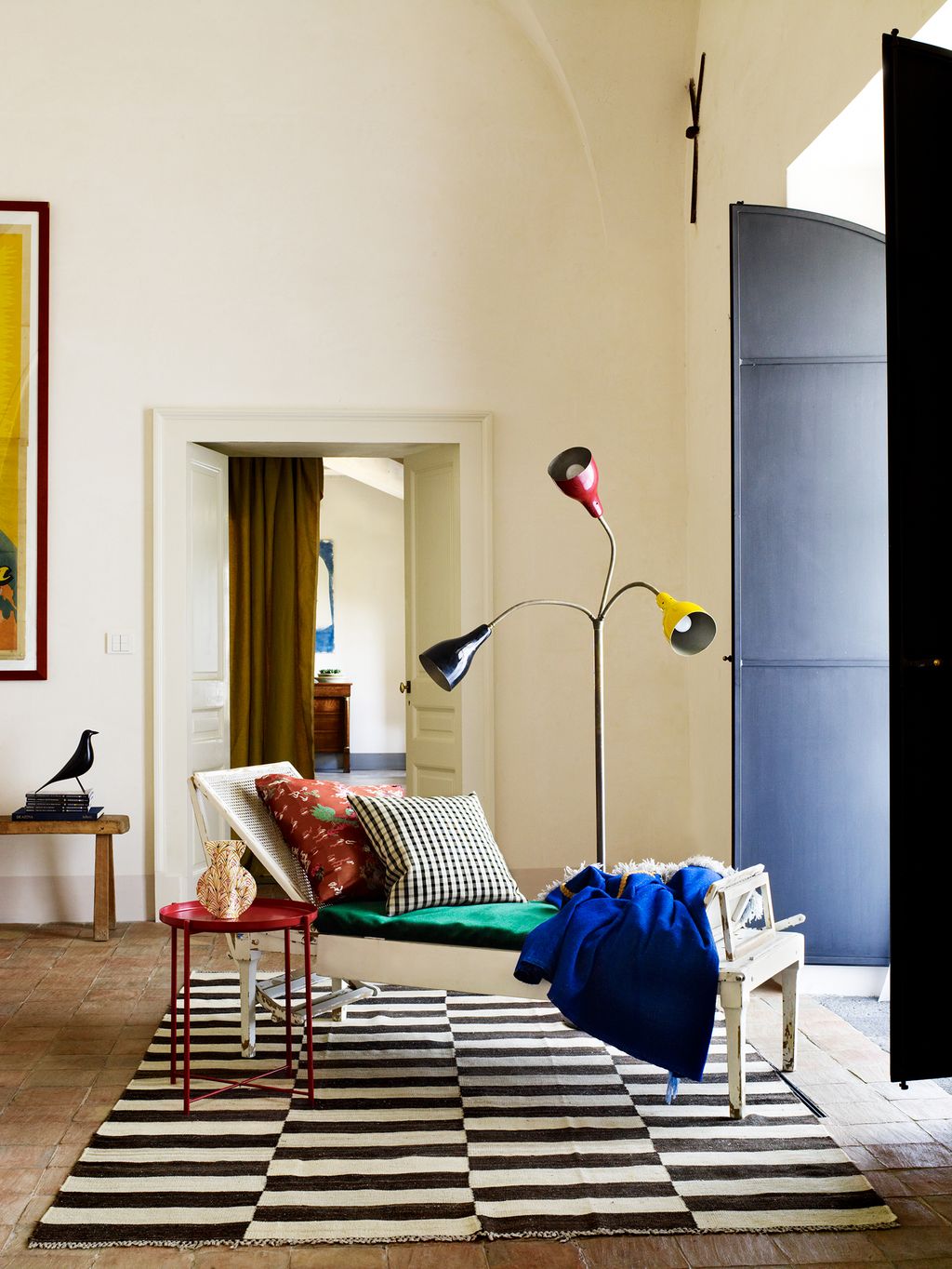 Image may contain Furniture Rug Living Room Indoors Room Couch Flooring Interior Design and Table