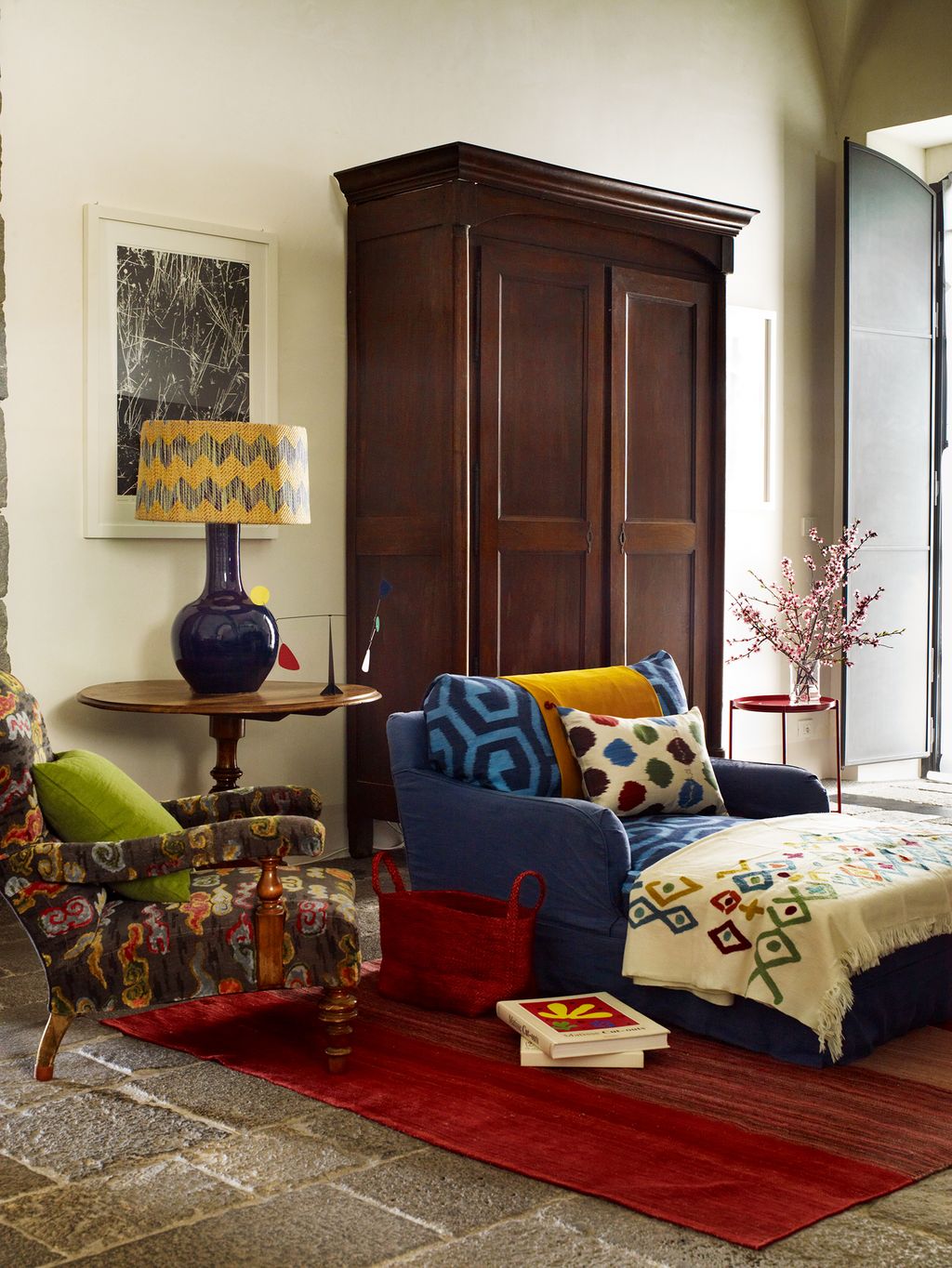 Image may contain Living Room Indoors Room Furniture Cushion Couch Interior Design and Bedroom