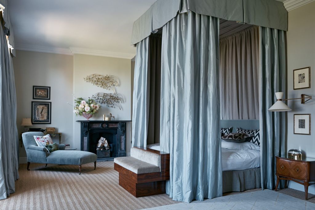 Image may contain Living Room Room Indoors Flooring Furniture Home Decor Interior Design Bed Couch Wood and Floor
