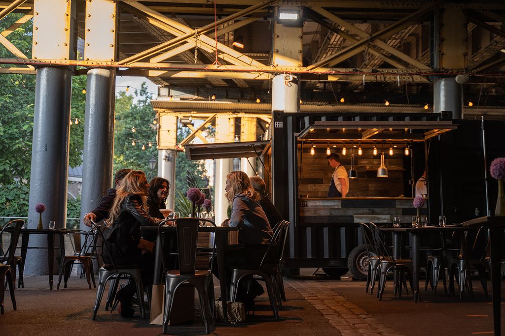 Image may contain Restaurant Cafe Human Person Furniture Chair Cafeteria Food Court Food and Wood