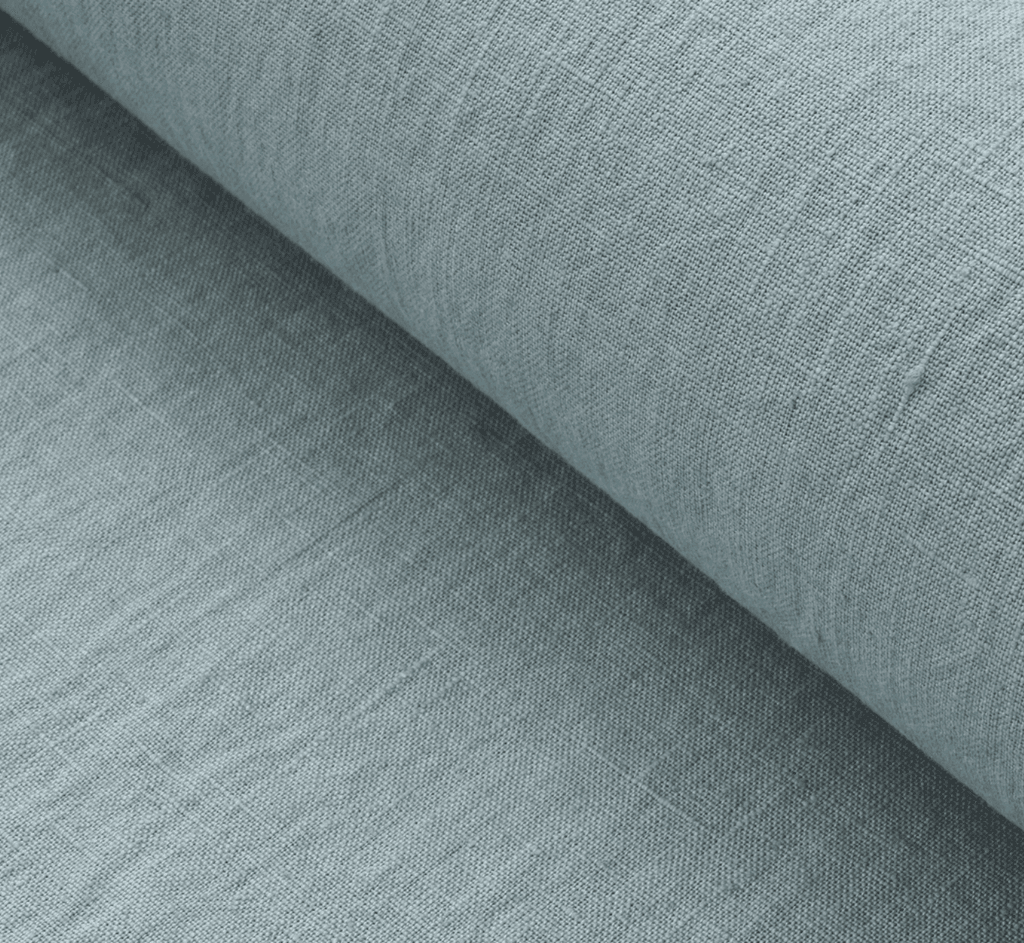 Image may contain Home Decor Clothing Apparel Pants Linen Denim Jeans and Rug