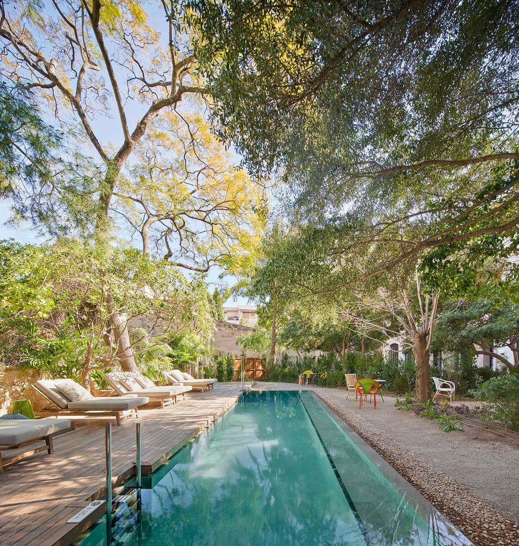 Image may contain Pool Water Building Hotel and Swimming Pool